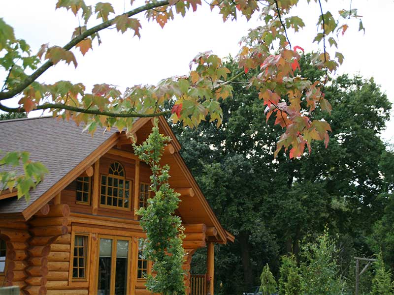 zijkant log home eigenaren melody ranch